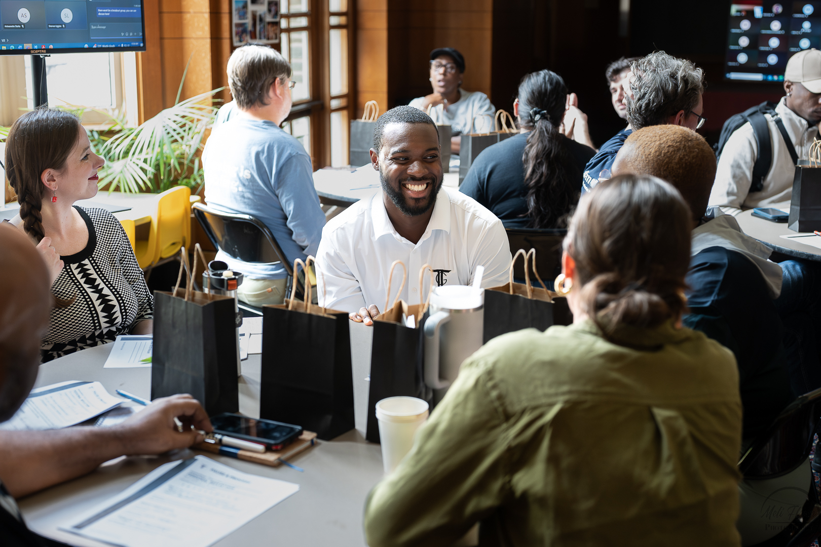 Builder's Circle members gathered around a table in community